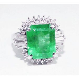 A Splendid emerald ring Showcasing a 3.97ct emerald cut bright…