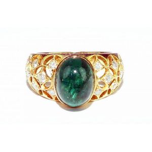 Emerald and diamond ring showing an oval cabochon cut bright…