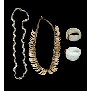 Four various Papua New Guinea body ornaments. Including dog's…