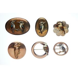 A selection of kookaburra brooches, four 9ct gold, silver lined…