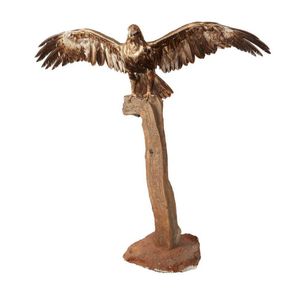 A taxidermy wedge tailed eagle, wings outstretched on a branch…