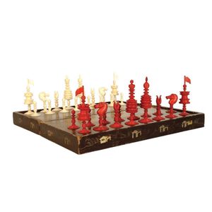 A good c.1900 carved and turned ivory chess set, one side red…