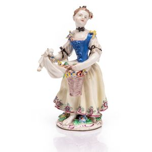 A Bow porcelain figure of a girl with a basket of flowers.&hellip;