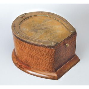 A oak horsehoe-shaped box, 19th century, the brass top engraved…