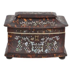 A Victorian tortoiseshell tea caddy with mother of pearl inlay…
