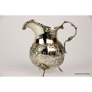 A sterling silver creamer in the Dutch manner, 1910 London,…