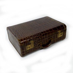 A leather faux alligator hide suitcase, the interior with…
