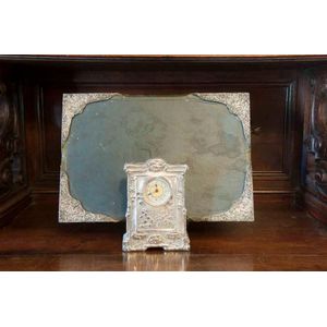 An English sterling silver mounted table clock and a silver…