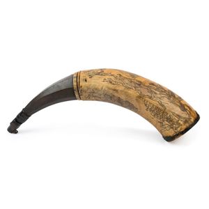 An antique scrimshaw powder horn engraved with hunting scenes…