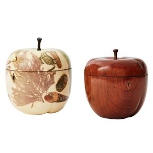 Two apple-shaped tea caddies, each with a hinged top, one…