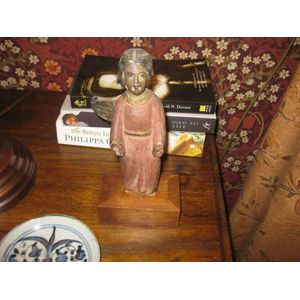 A small naïve wooden carving of a saint, possibly Portuguese,…