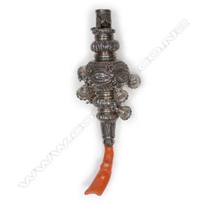 A Victorian silver and coral baby's rattle, the fancy body with…