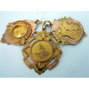 Three 9ct gold shield fob medallions 'Sunlight cup', Nsfa 1920…