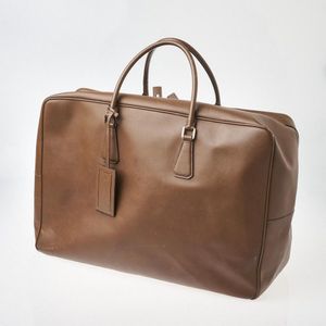 Gucci, a vintage Gladstone bag, designed with a cream canvas exterior, tan  leather trim, brushed gol