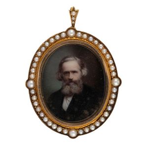 A Colonial miniature portrait painted on glass in 15ct yellow…