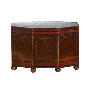 A George III octagonal mahogany tea caddy, with inlaid…