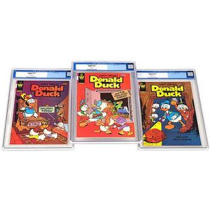 Three vintage Walt Disney Donald Duck Comics all with Cgc…