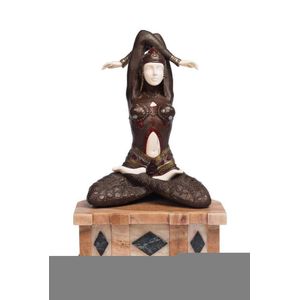 A bronze and ivory figure of a seated exotic dancer, 20th…