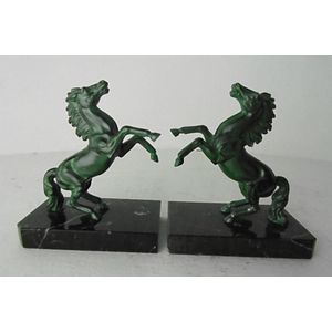 A pair of French spelter rearing horse figured bookends on…