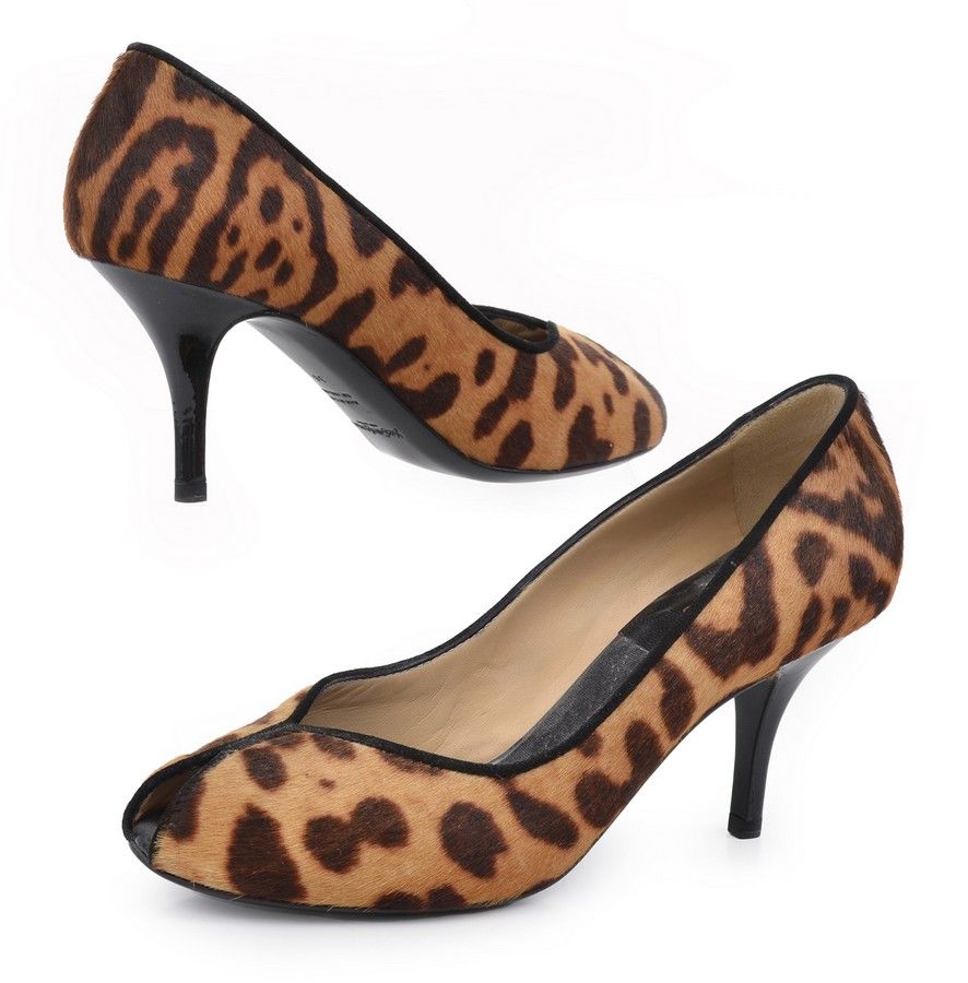 A pair of heels by Yves Saint Laurent, styled in leopard print ...