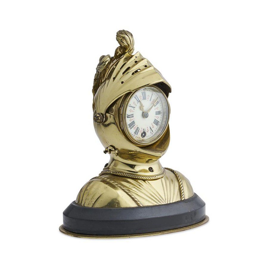 A knight armour clock, in brass with Arabic numeral face,… Clocks