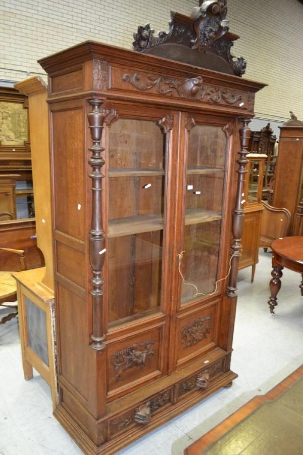 Antique French  carved oak two door bookcase  two drawers  