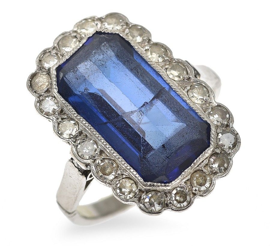 An Art Deco sapphire and diamond ring, the emerald cut