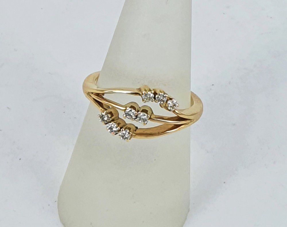 An Eight-Stone diamond ring, in 14ct yellow gold. Estimated… - Rings ...