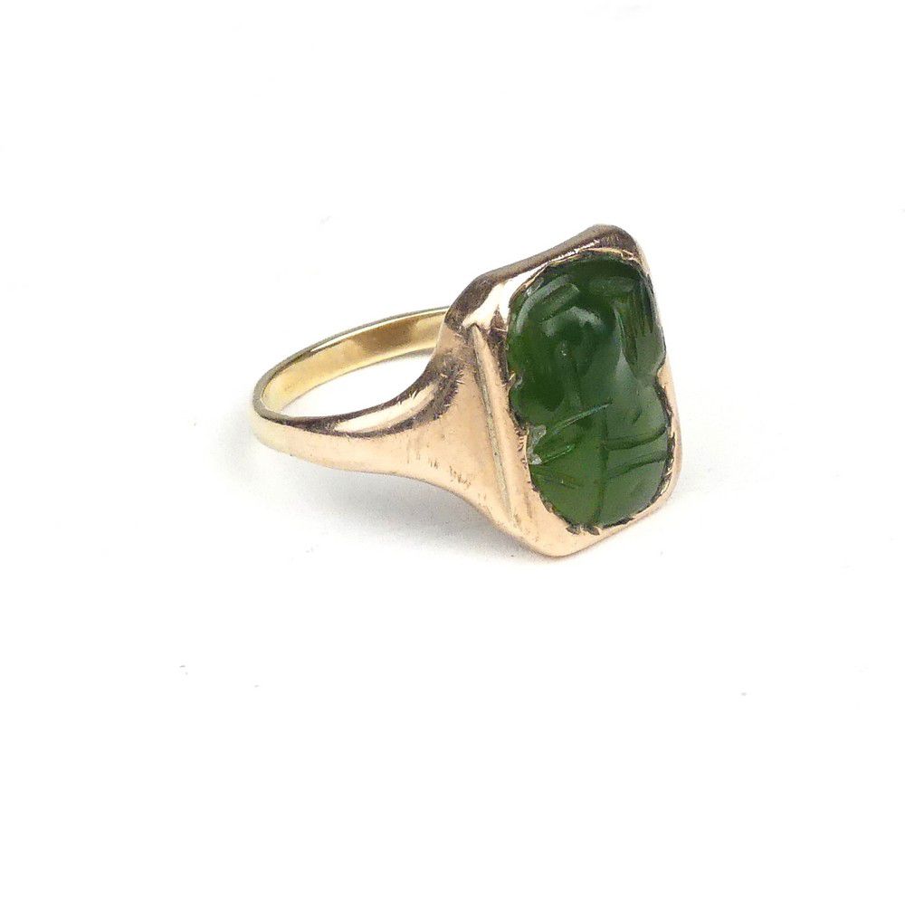 A 9ct. rose gold greenstone tiki mounted signet ring, the tiki… - Rings ...