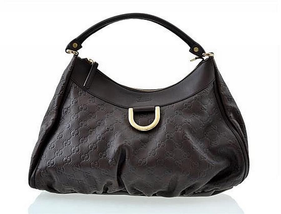 A handbag by Gucci, styled in brown leather with gold metal… - Handbags & Purses - Costume ...