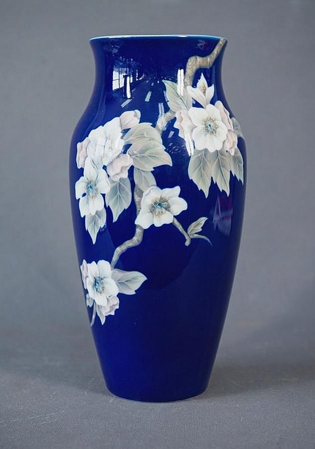 Royal Copenhagen vase. White blossom decoration on blue ground