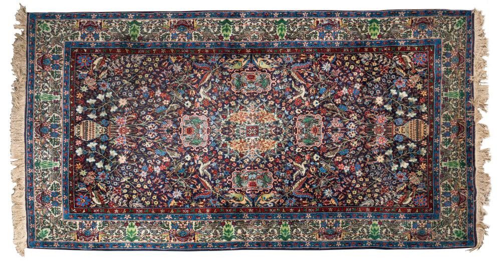 A Persian handknotted wool rug with blue and green floral… Rugs & Carpets Textiles & Fabrics