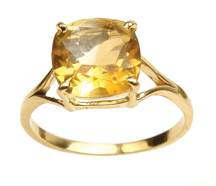 A 14ct. yellow gold and citrine lady's dress ring, the cushion… - Rings ...