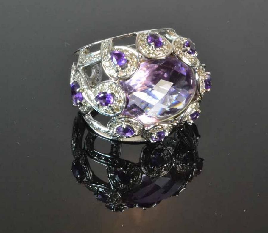 Amethyst and diamond ring. A large central pale amethyst… - Rings ...