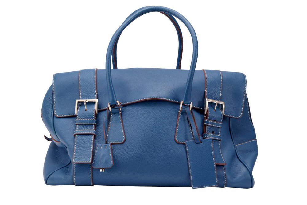 A 'Sacca Da Viaggio' travel bag by Prada, styled in blue… - Handbags ...