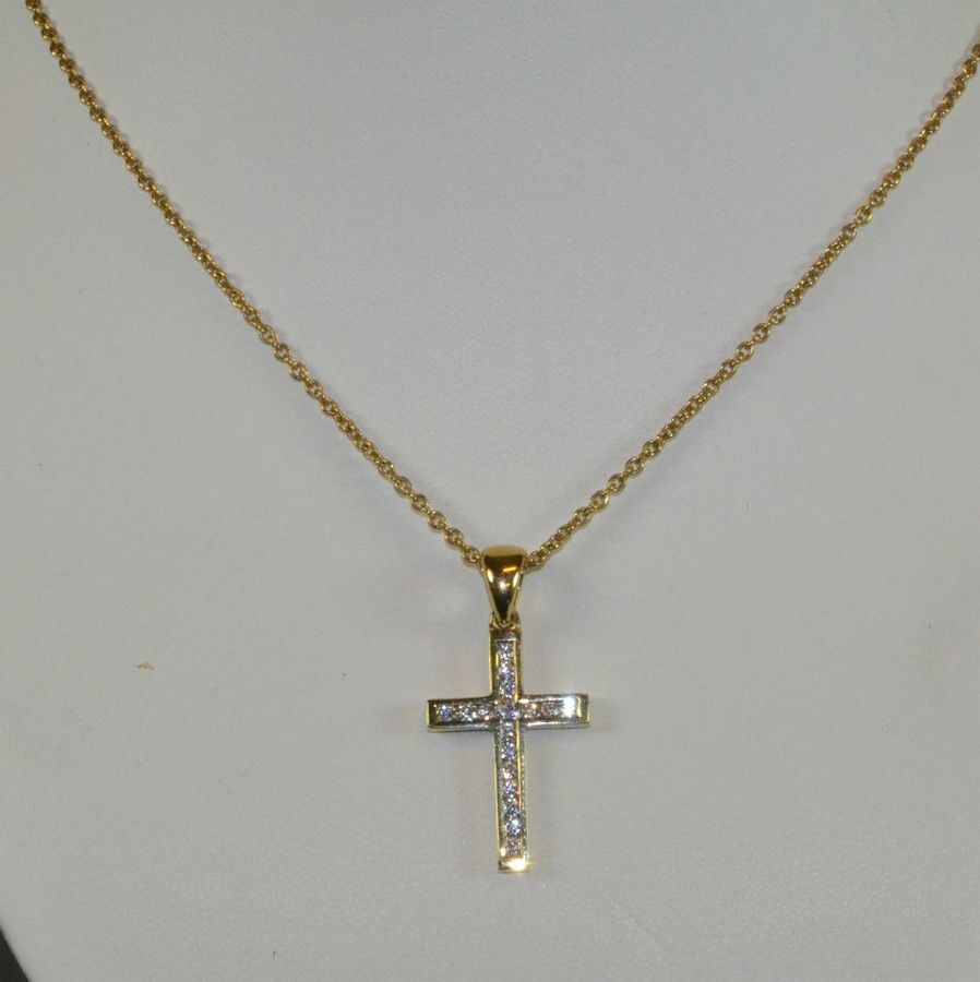 18ct yellow gold diamond cross. An 18ct channel set diamond… - Necklace ...