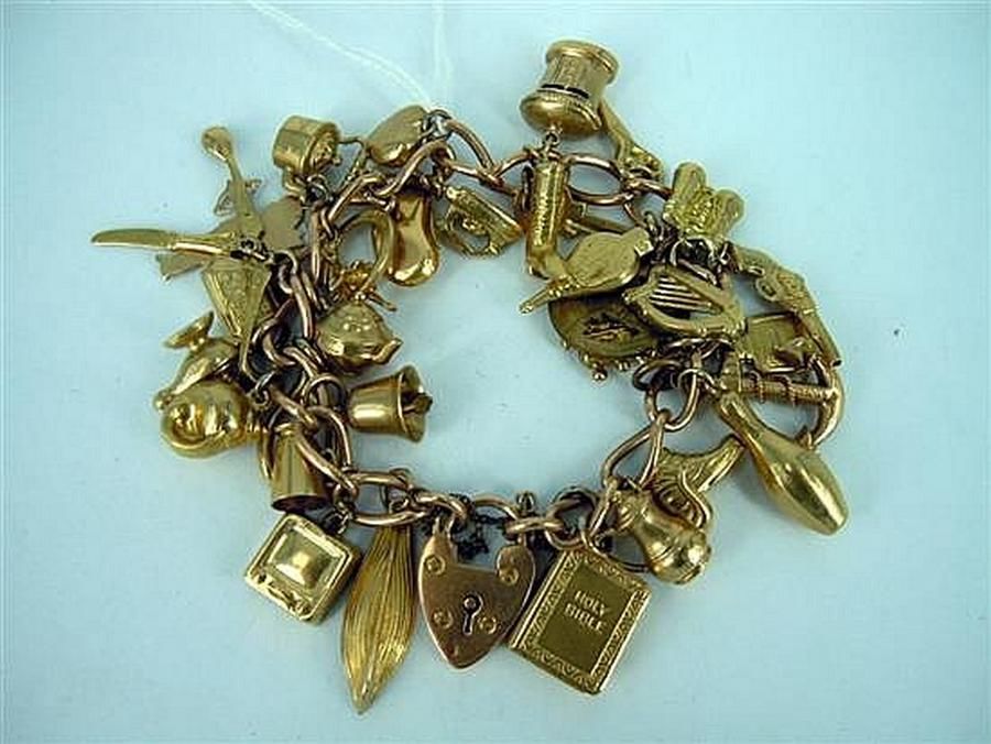 A 9ct gold vintage charm bracelet. Weight: 42.2g - Bracelets/Bangles ...