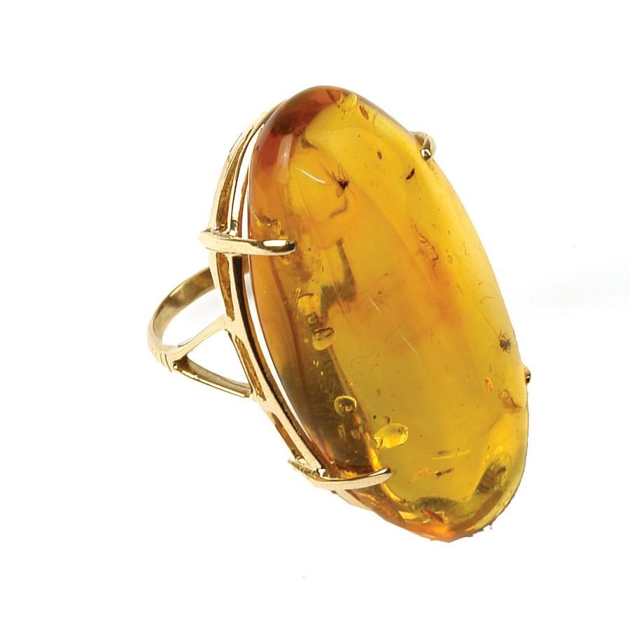 A 14ct. yellow gold and large polished amber nugget dress ring ...