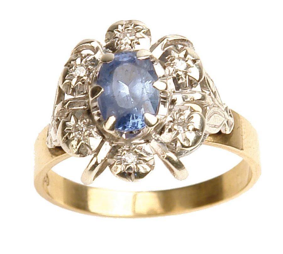 A 9ct. yellow and white gold, sapphire and diamond cluster ring ...