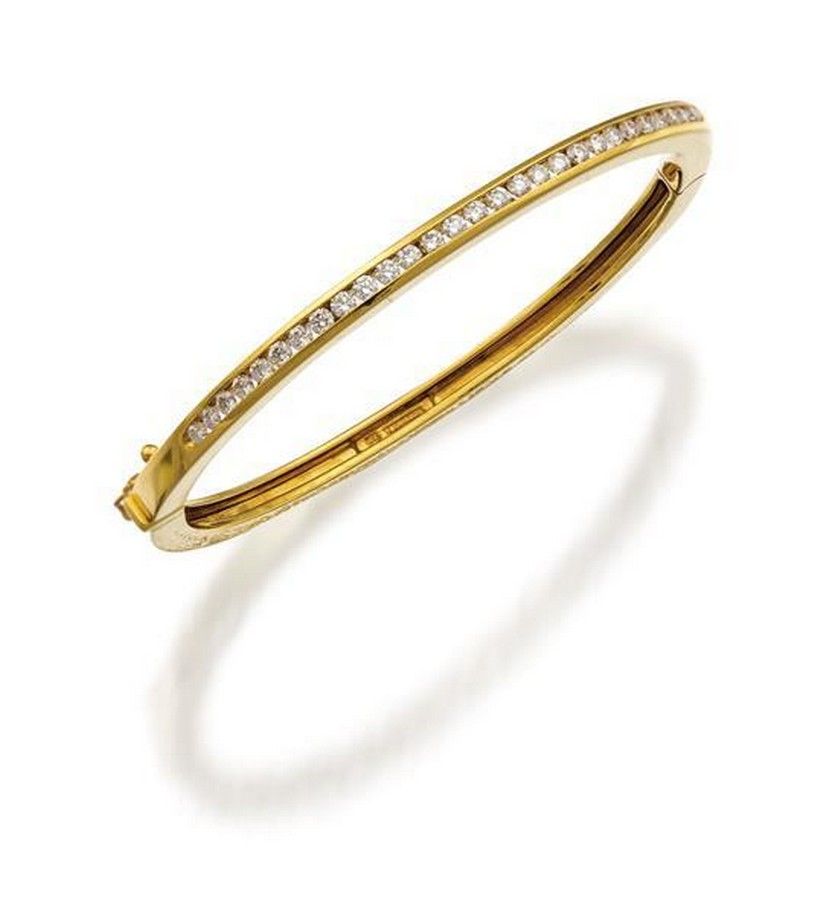 18ct gold and diamond bangle, Tiffany & Co., the oval hinged ...
