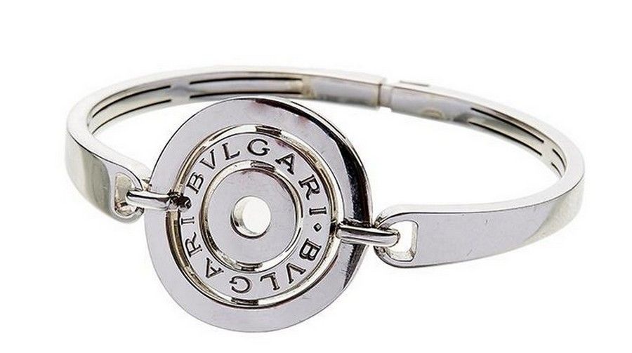 A white gold 'Astrale' bangle by Bulgari, centring on a curved ...