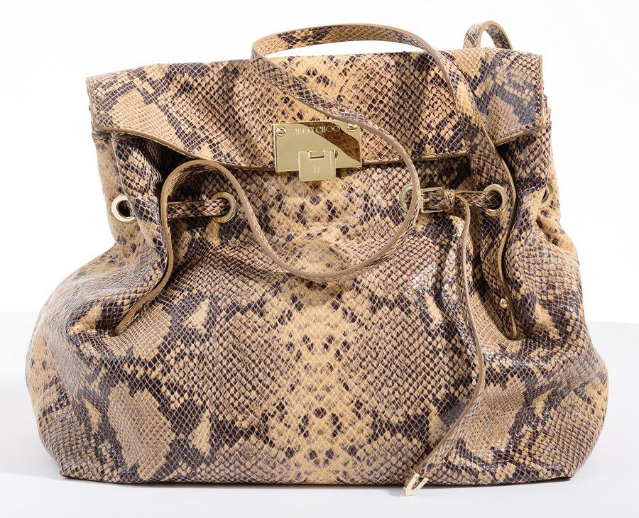 A handbag by Jimmy Choo, styled in snakeskin print leather with