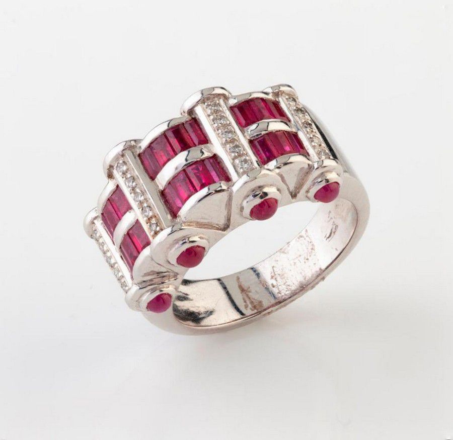 A ruby and diamond ring the wide band set with horizontal bands