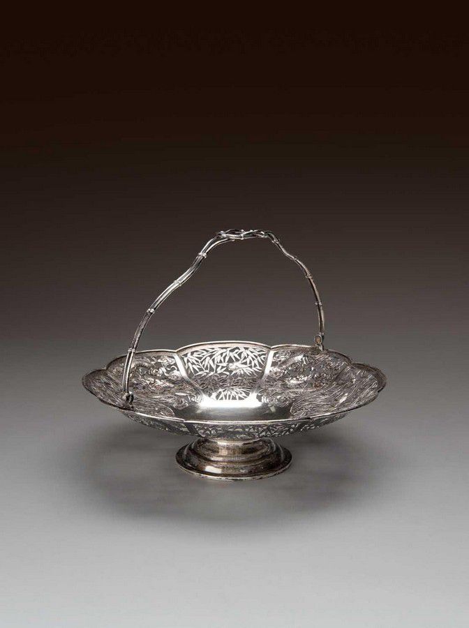 A Chinese Silver Pierced Circular Swing Handle Basket By