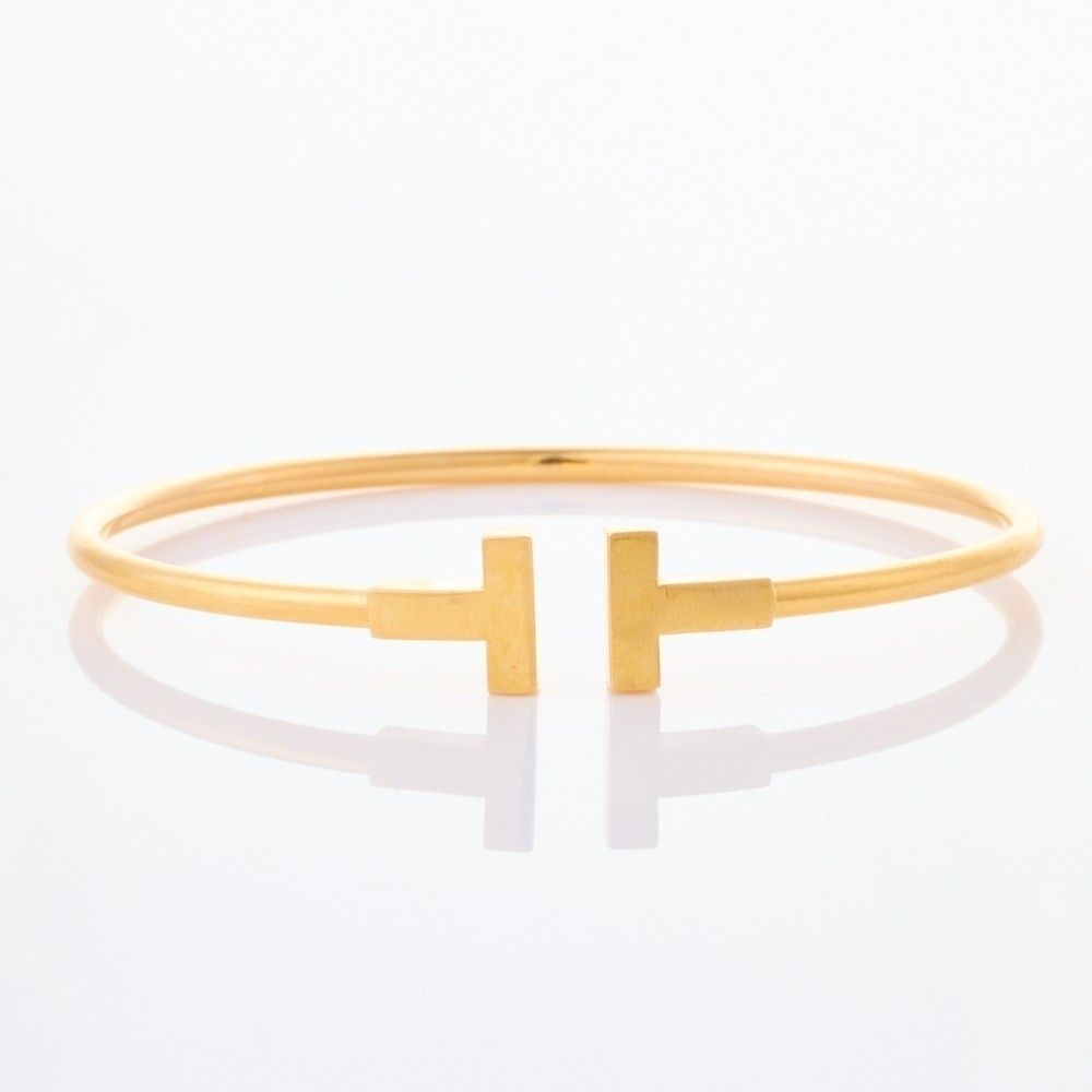 Tiffany & Co, 18ct yellow gold, 'Tiffany T' wire bracelet,… - Bracelets ...