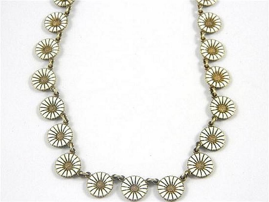 A sterling silver daisy necklace with white enamel and gold… - Necklace