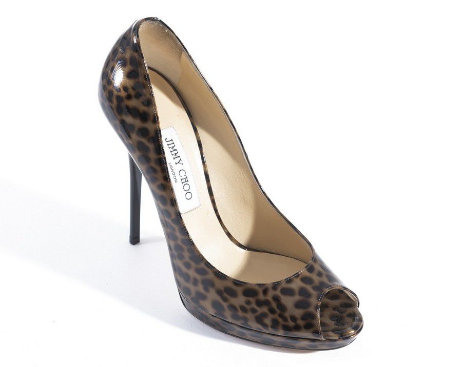 A pair of heels by Jimmy Choo, styled in patent leather leopard ...