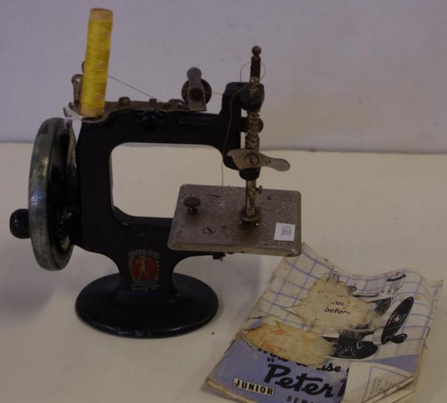 Lot - CHILD'S ANTIQUE PETER PAN SEWING MACHINE
