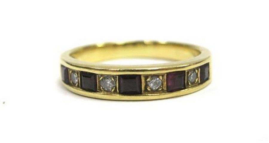 An 18ct yellow gold ruby & diamond band ring, five square… - Rings