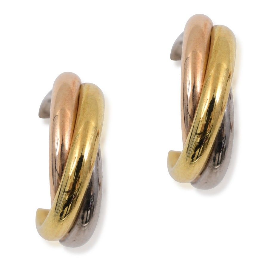 A pair of gold earrings by Cartier, from the Trinity de Cartier